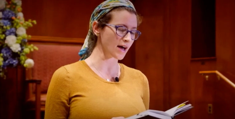 Woman reading from the bible