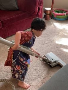 little boy vacuuming