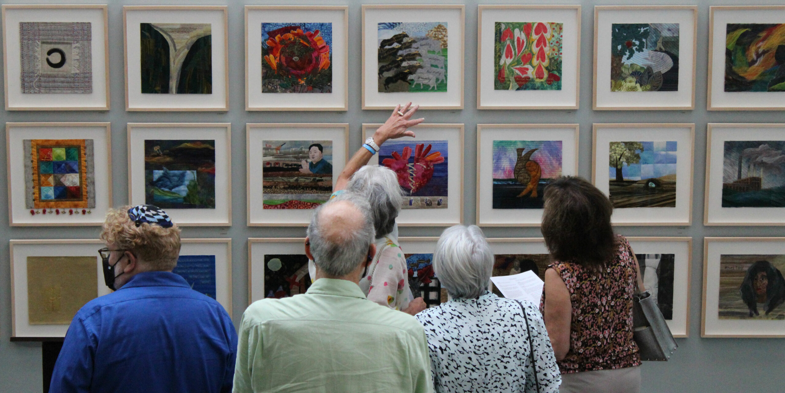 people viewing art exhibit