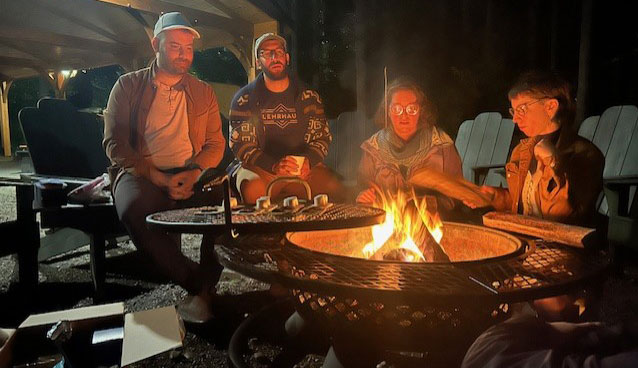 students around a campfire