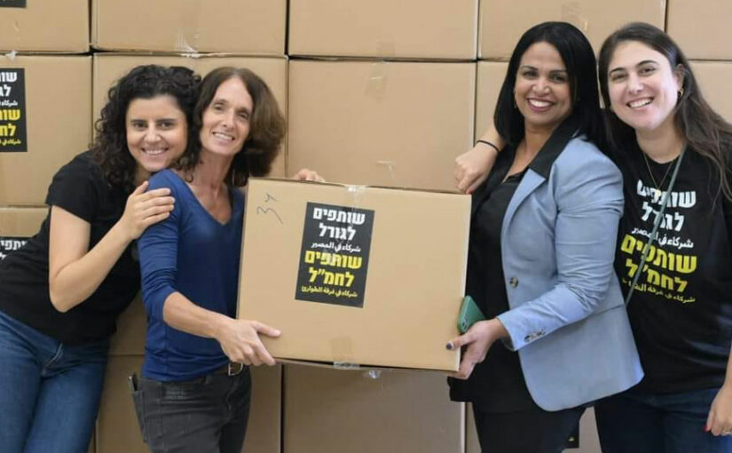 4 women holding boxes