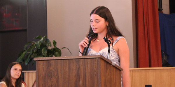 teen speaking at a podium