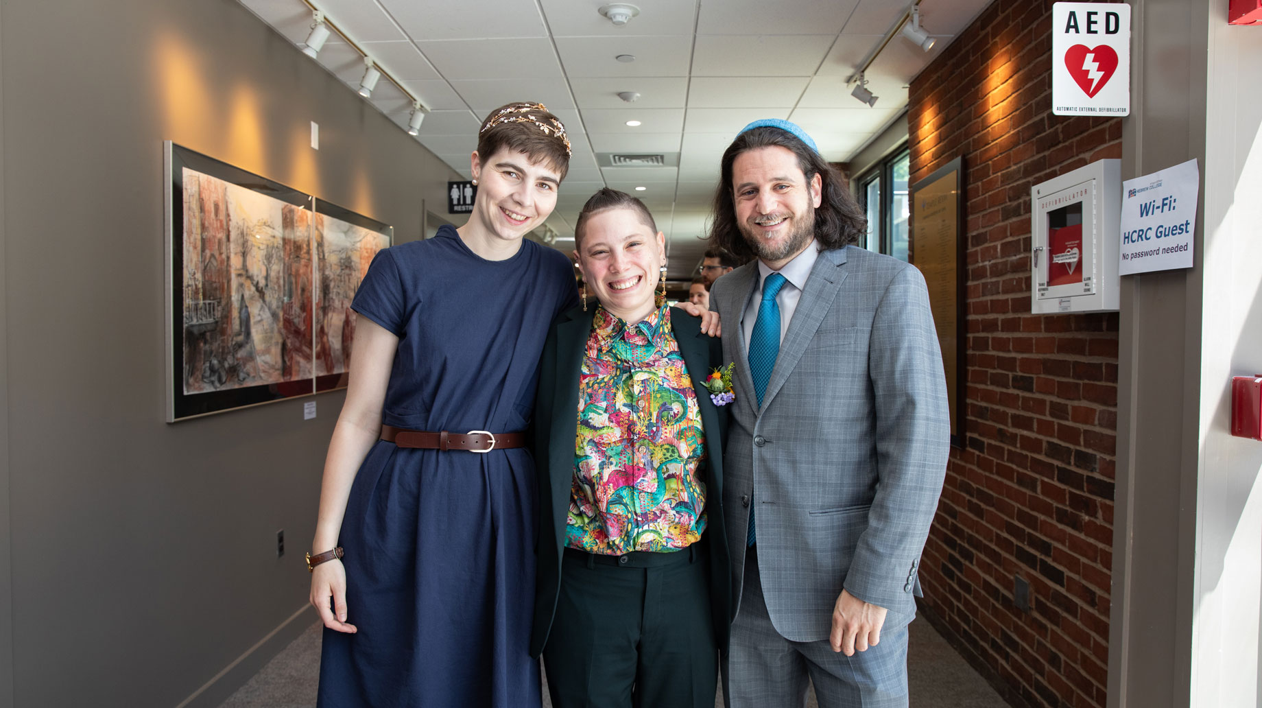 3 rabbibnical students smiling