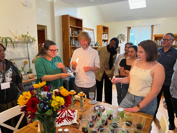 jpordan-braunig and students lighting shabbat candles