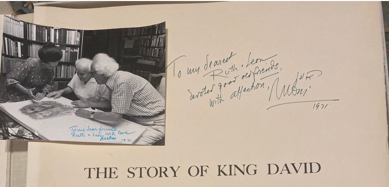 Photo of artist and handwritten dedication on folio cover