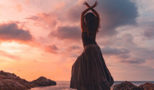 woman dancing on rocks